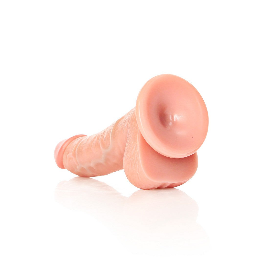 DILDO REALISTA CON TESTICULOS CURVED 6 /15,5 CM FLESH REALROCK