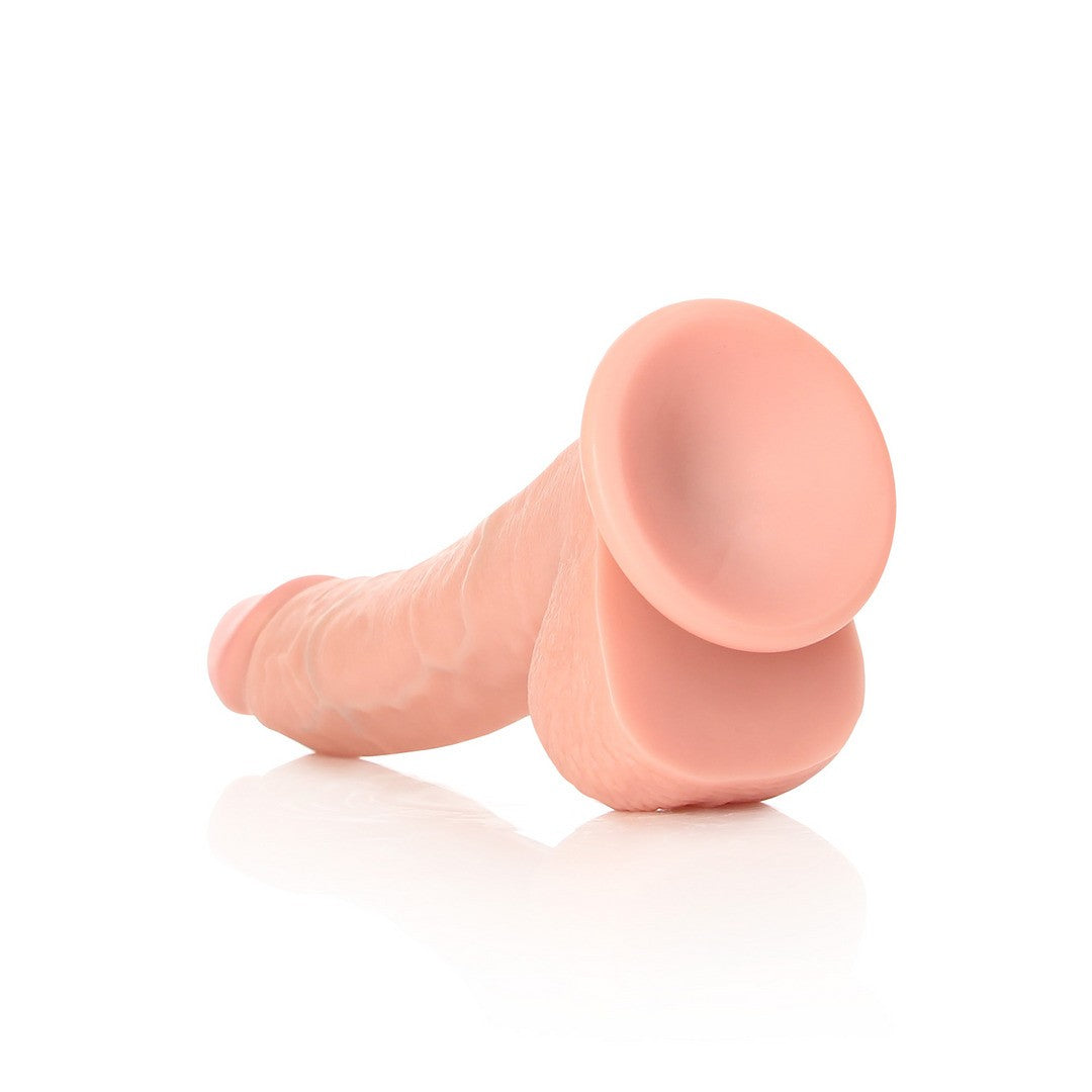DILDO REALISTA CON TESTICULOS CURVED 8 /20,5 CM FLESH REALROCK