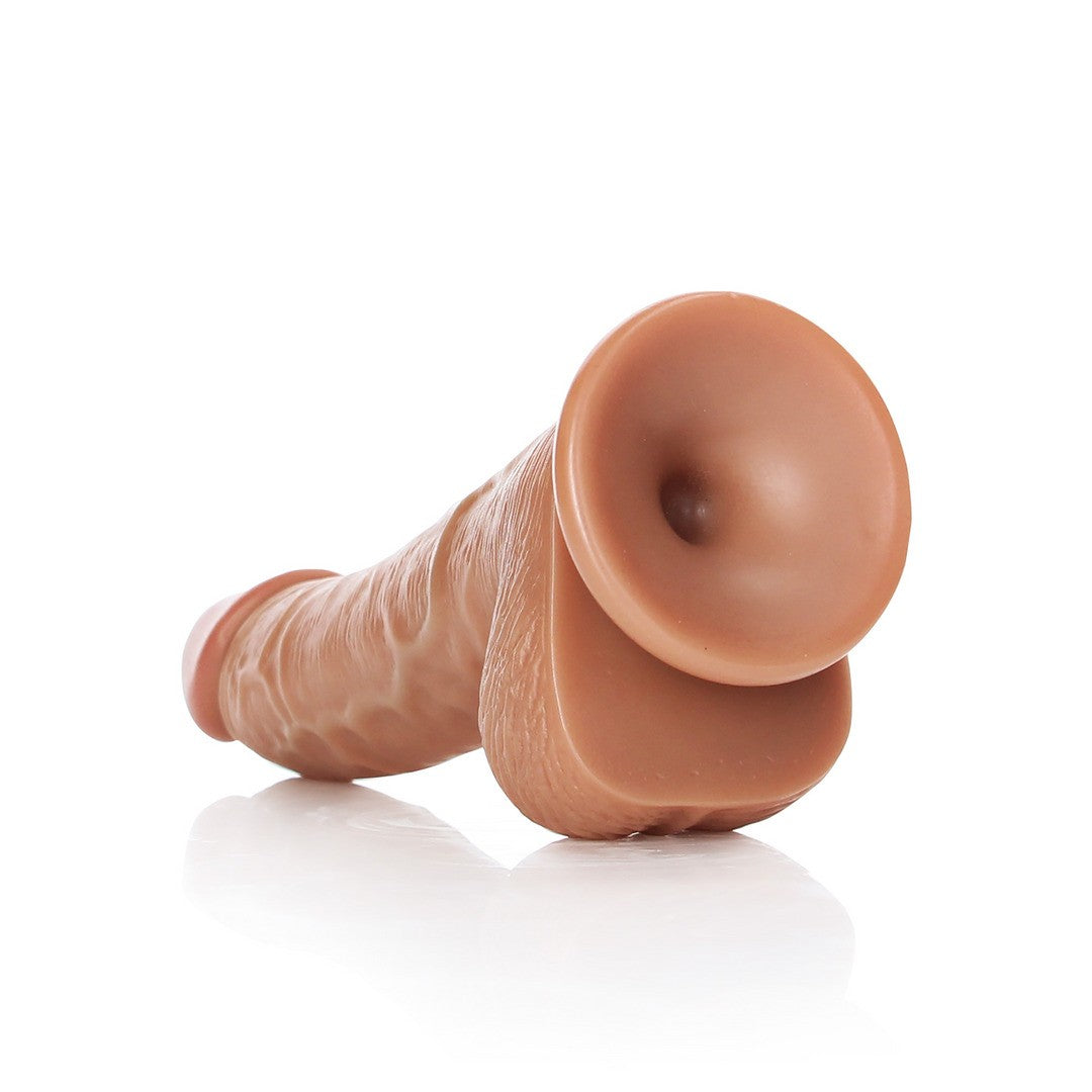 DILDO REALISTA CON TESTICULOS CURVED 6 /15,5 CM REALROCK