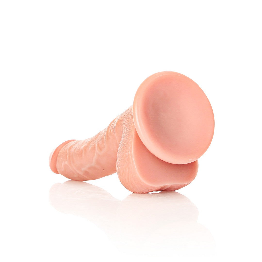 DILDO REALISTA CON TESTICULOS CURVED 7 /18CM FLESH REALROCK