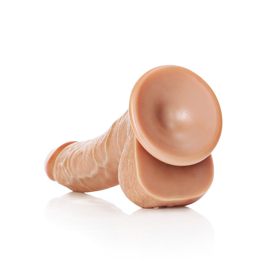 DILDO REALISTA CON TESTICULOS CURVED 8 /20,5 CM REALROCK